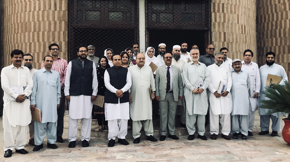 The Vice Chancellor University of Peshawar Prof. Dr. Muhammad Asif Khan  pose for a group photo after the first general orientation session about Community Service Programs at SSAQ hall with the departmental heads on 25th September, 2018.